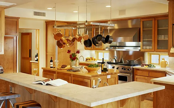 A stylish modern kitchen with stainless steel appliances and smooth countertops.